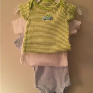 Three onesies- 2 carters and 1 Gerber newborn